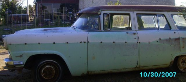 1956 white and turquoise Ford Fairlane 4 dr sta wag station wagon