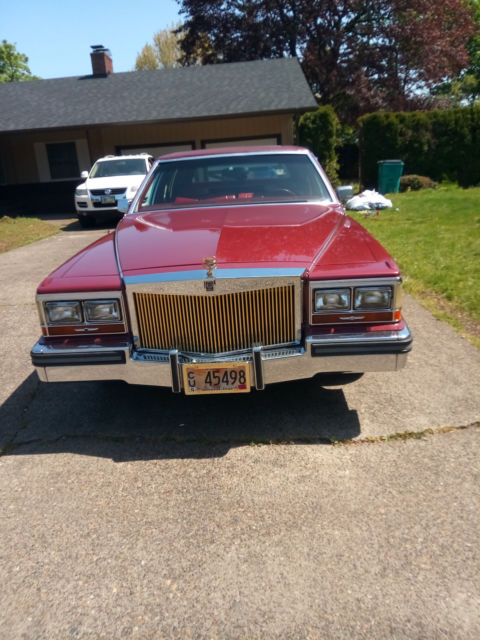 1987 Red Cadillac Brougham Sedan