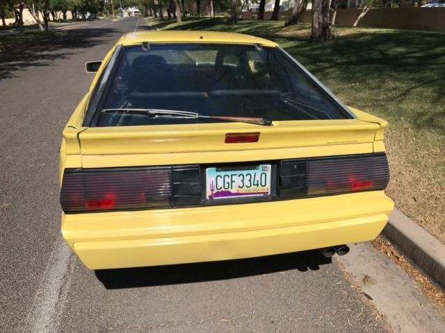 1989 Yellow Chrysler Conquest Hatchback