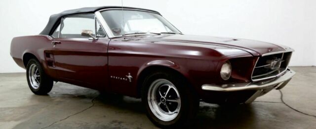 1967 burgundy Ford Mustang convertible