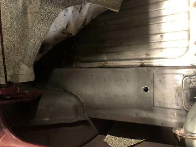 1967 burgundy Ford Mustang convertible