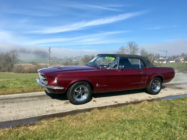 1967 burgundy Ford Mustang convertible