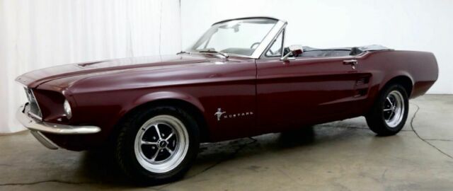 1967 burgundy Ford Mustang convertible