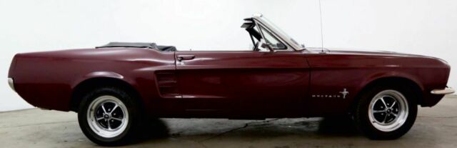 1967 burgundy Ford Mustang convertible