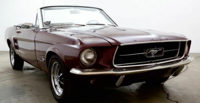 1967 burgundy Ford Mustang convertible
