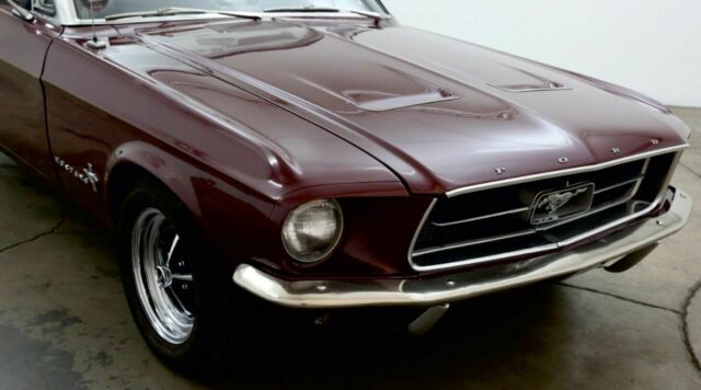 1967 burgundy Ford Mustang convertible