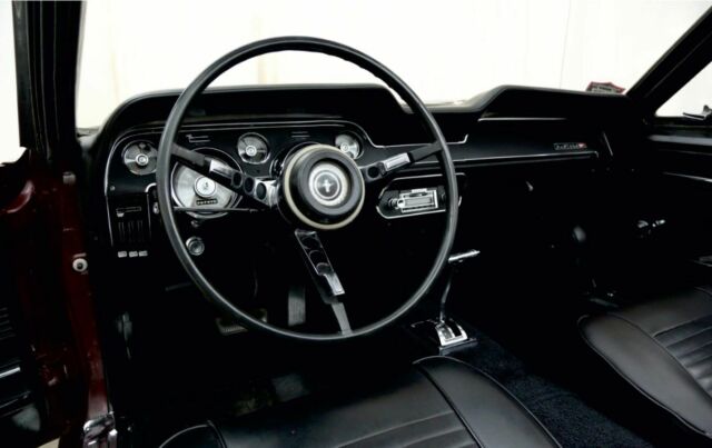 1967 burgundy Ford Mustang convertible
