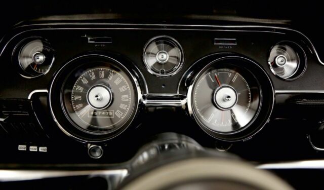 1967 burgundy Ford Mustang convertible