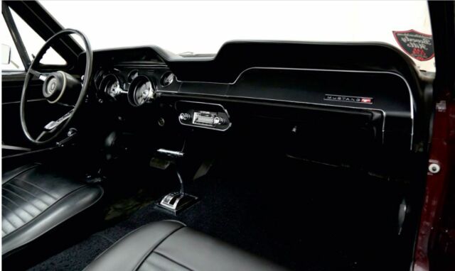 1967 burgundy Ford Mustang convertible