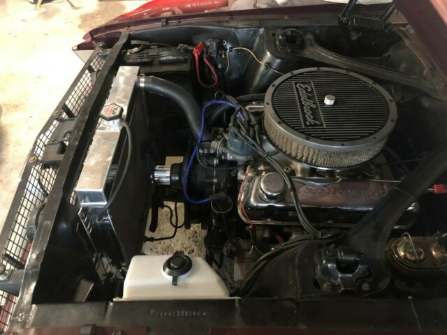 1967 burgundy Ford Mustang convertible