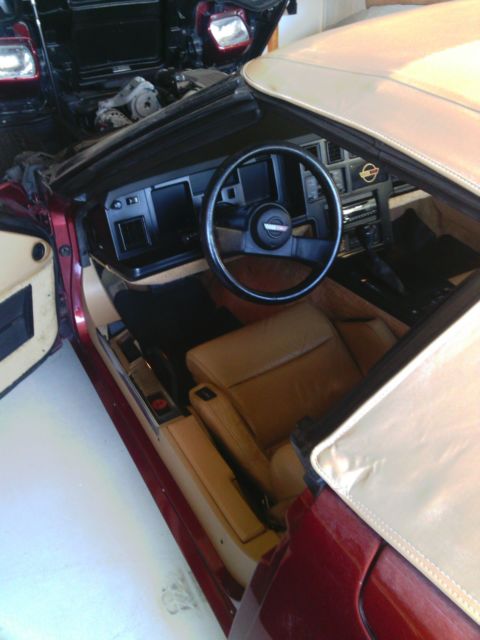 1987 dark red Chevrolet Corvette Convertible