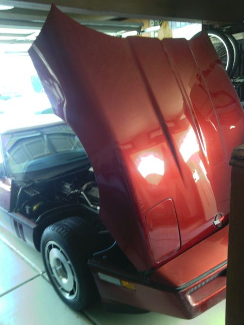 1987 dark red Chevrolet Corvette Convertible