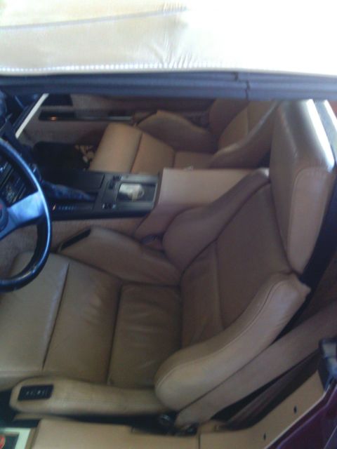 1987 dark red Chevrolet Corvette Convertible