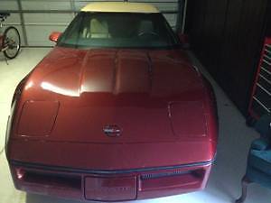 1987 dark red Chevrolet Corvette Convertible