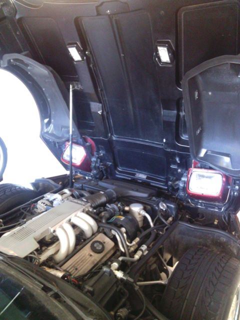 1987 dark red Chevrolet Corvette Convertible