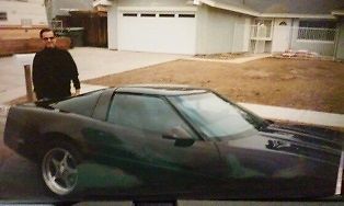1990 dark green metallic Chevrolet Corvette Coupe