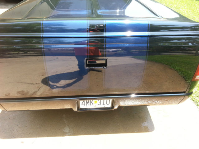 1989 black and blue GMC Sierra 1500