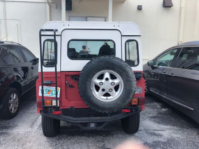 1994 Red Land Rover Defender SUV