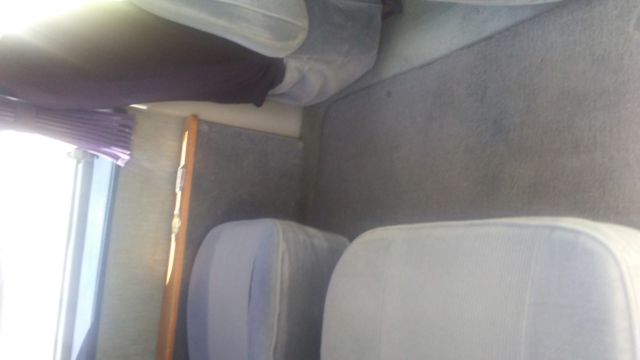 1992 silver and teal Dodge Ram Van Standard Passenger Van