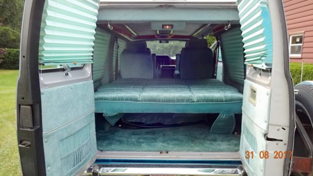 1992 silver and teal Dodge Ram Van Standard Passenger Van