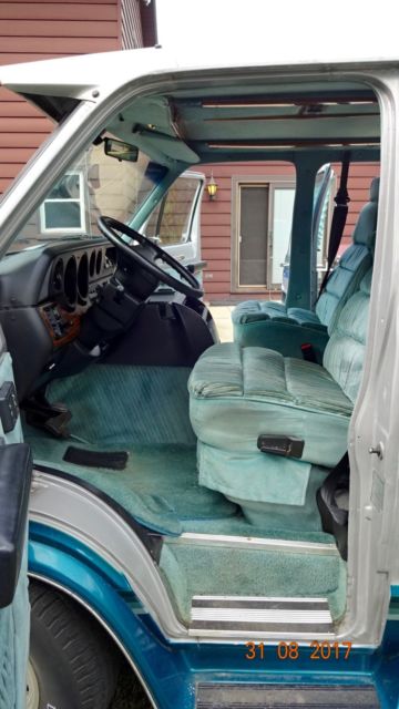1992 silver and teal Dodge Ram Van Standard Passenger Van