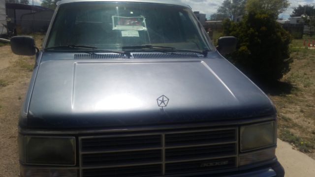 1992 silver and teal Dodge Ram Van Standard Passenger Van