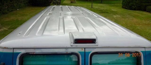 1992 silver and teal Dodge Ram Van Standard Passenger Van