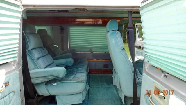 1992 silver and teal Dodge Ram Van Standard Passenger Van