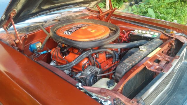 1970 burnt orange Dodge Challenger