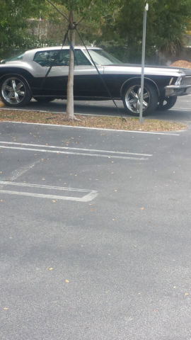 1971 Black, silver and red Buick Riviera 2 door