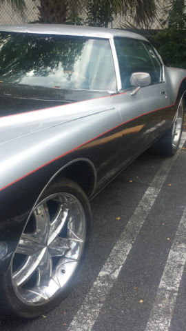 1971 Black, silver and red Buick Riviera 2 door