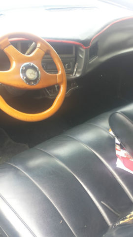 1971 Black, silver and red Buick Riviera 2 door