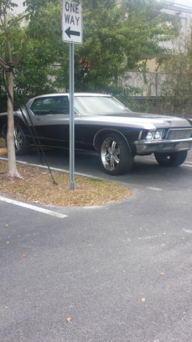 1971 Black, silver and red Buick Riviera 2 door
