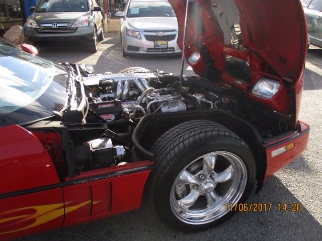 1989 red Chevrolet Corvette Coupe