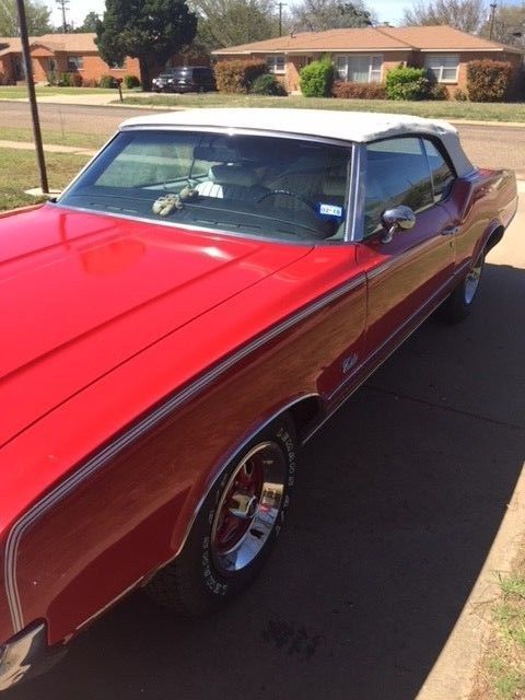 1972 red Oldsmobile Cutlass Convertible