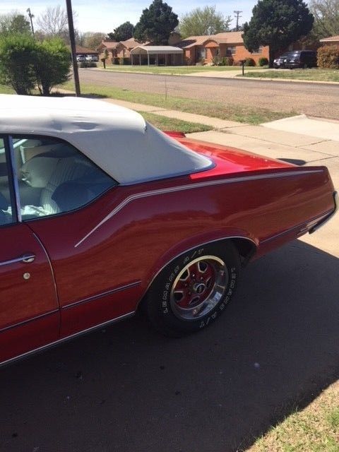 1972 red Oldsmobile Cutlass Convertible