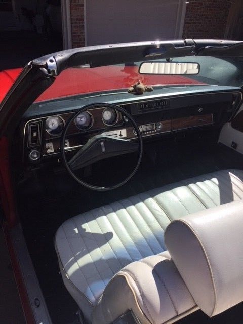 1972 red Oldsmobile Cutlass Convertible