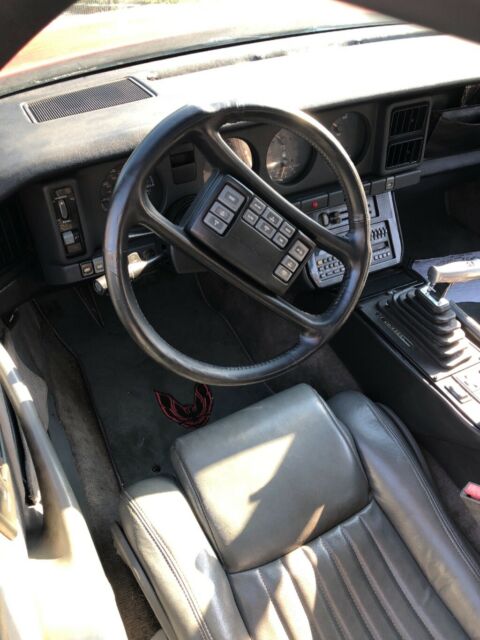 1989 Red Pontiac Firebird Fastback