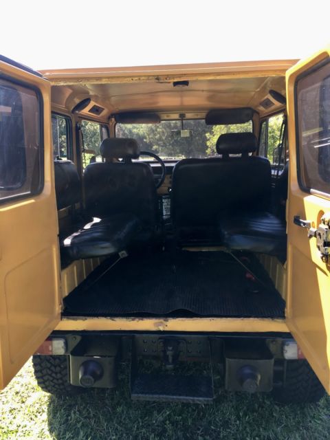 1976 yellow/white Toyota Land Cruiser SUV