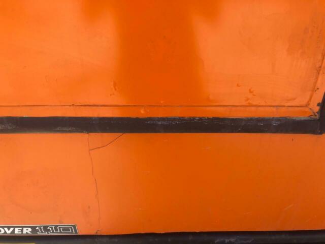 1993 Orange Land Rover Defender