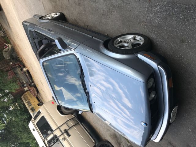 1988 blue/silver BMW 3-Series Convertible