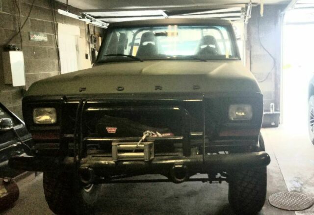 1978 Army green Ford Bronco SUV