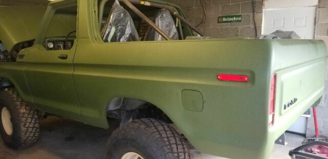 1978 Army green Ford Bronco SUV