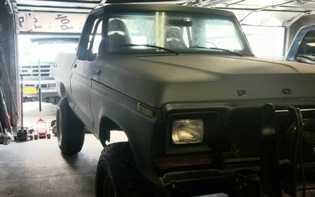 1978 Army green Ford Bronco SUV