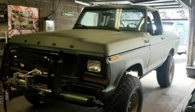 1978 Army green Ford Bronco SUV