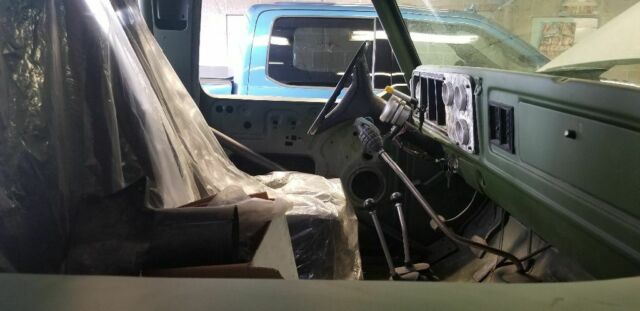 1978 Army green Ford Bronco SUV