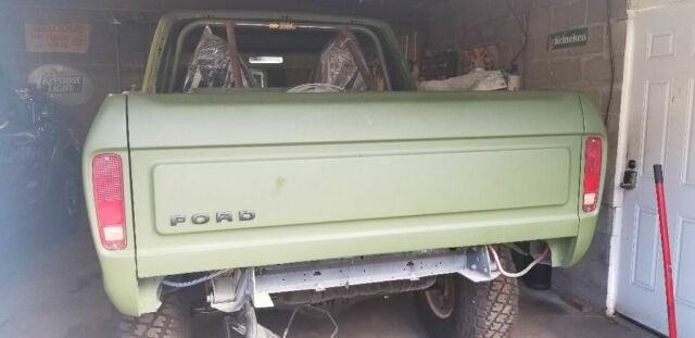 1978 Army green Ford Bronco SUV