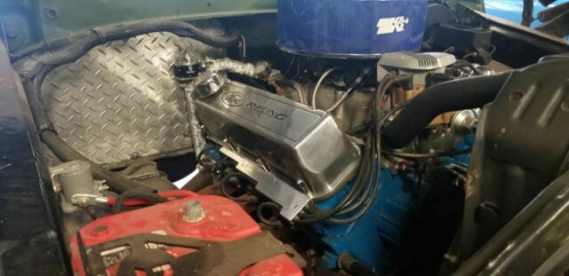 1978 Army green Ford Bronco SUV