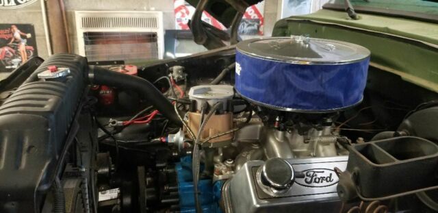 1978 Army green Ford Bronco SUV