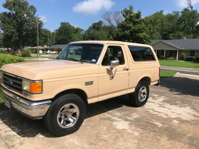 1990 pale brown (nude pantyhose) Ford Bronco Convertible